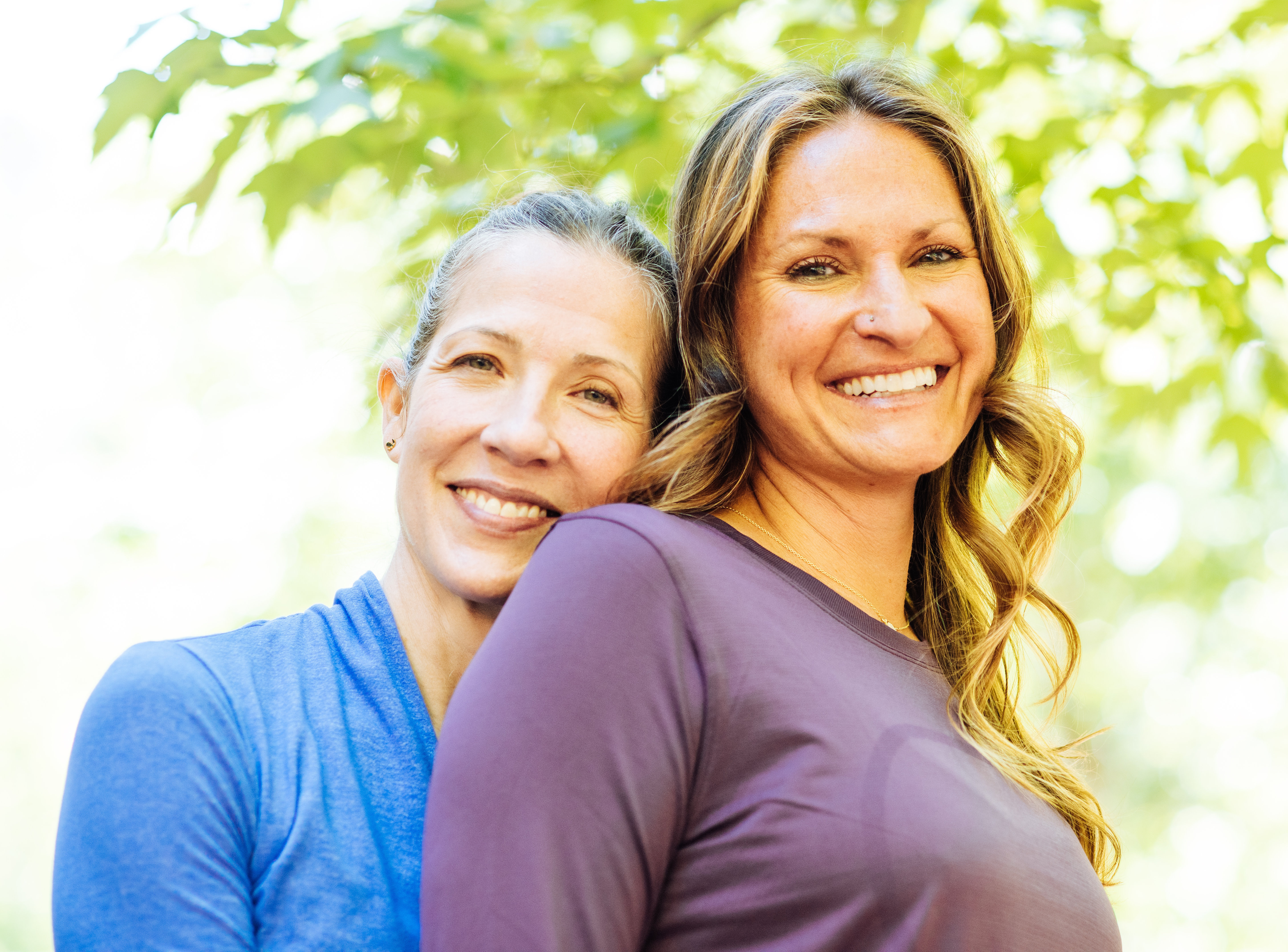 Deb and Mischa smile for the camera outside of InsideOut Body Therapies.