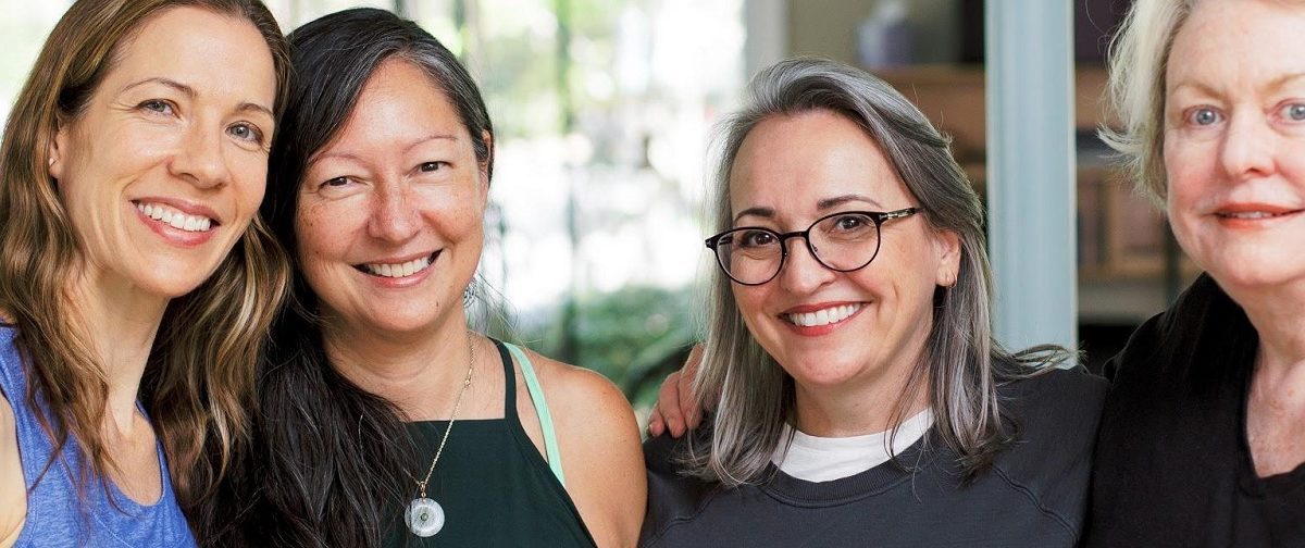 Two women smiling for a picture together.