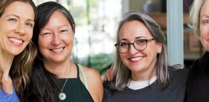 Two women smiling for a picture together.