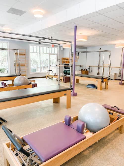 A gym with many different equipment in it